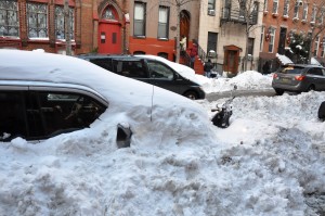 City cars buried in snow (from Wikimedia)